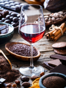 Various chocolates with red wine glass