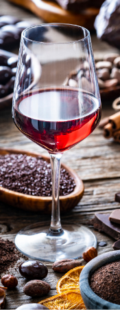 Various chocolates with red wine glass