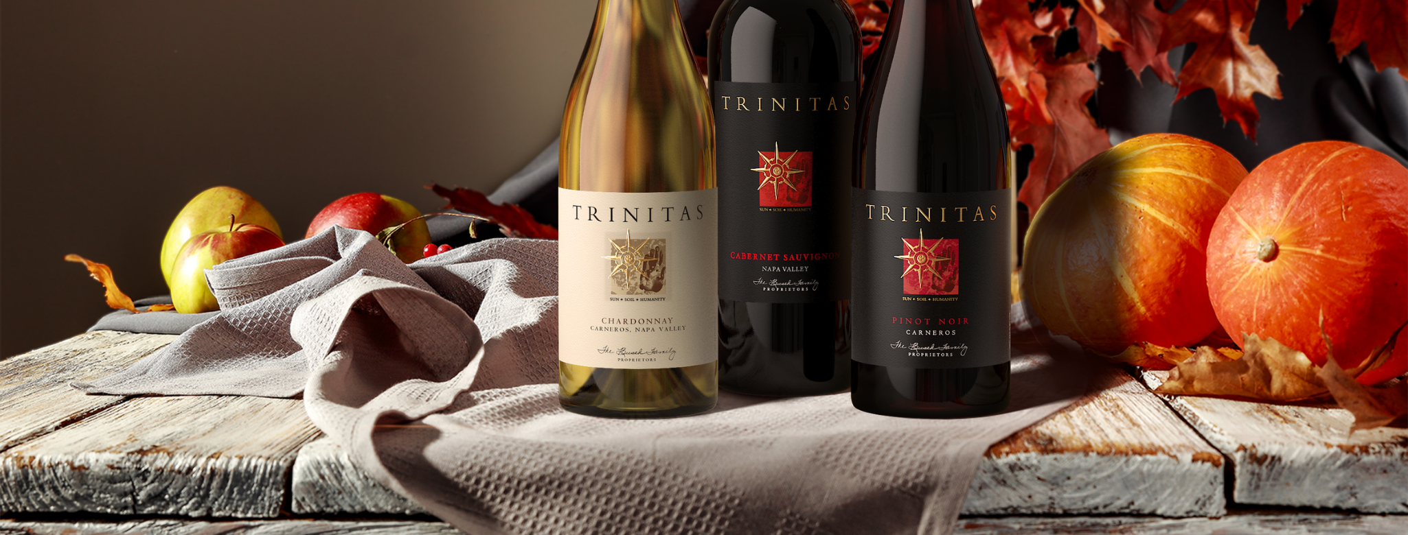 FallBanner (2) 3 bottles of Trinitas wines with fall decor