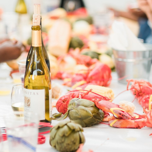 Trinitas Chardonnay next to lobster feed food