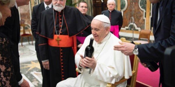 The Pope receiving a gift of wine from Tim and Steph Busch