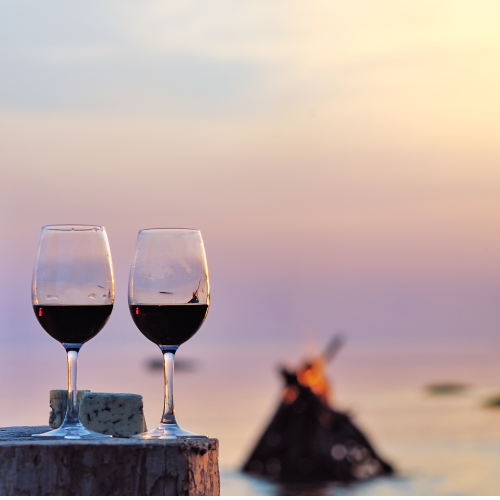 glasses of wine by the beach