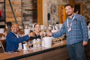 Winemaker Kale Anderson toasting with two tasting guests