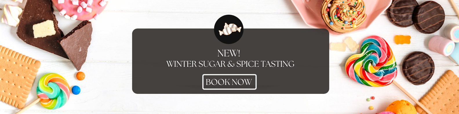 Winter Sugar & Spice Tasting promotional banner with colorful candies, cookies, and chocolates displayed on a white wooden background.”