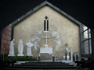 Sanctuary at Knock Shrine in Ireland depicting the 1879 apparition of Our Lady of Knock with Mary, Saint Joseph, Saint John, and the Lamb on the altar