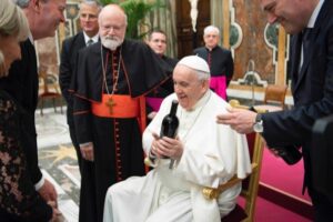 The Pope receiving a gift of wine from Tim and Steph Busch