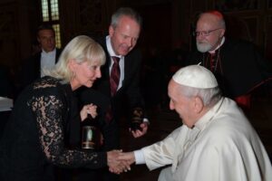 The Pope receiving a gift of wine from Tim and Steph Busch