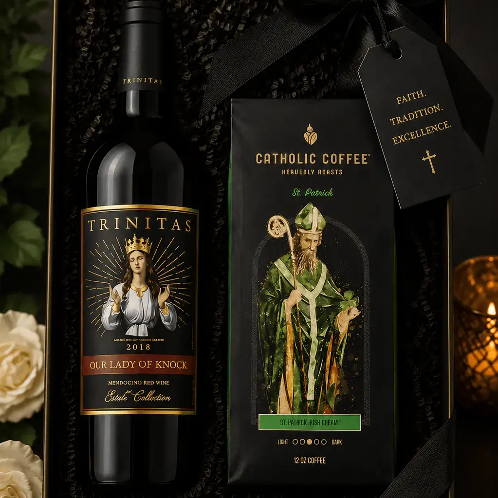 A gift box with Trinitas wine, Catholic Coffee, a black ribbon, and a tag reading Faith. Tradition. Excellence.